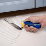 QEP 1/4 in. x 1/4 in. x 1/4 in. Comfort Grip Square-Notch Margin Flooring Trowel with Bucket Hook (42114)